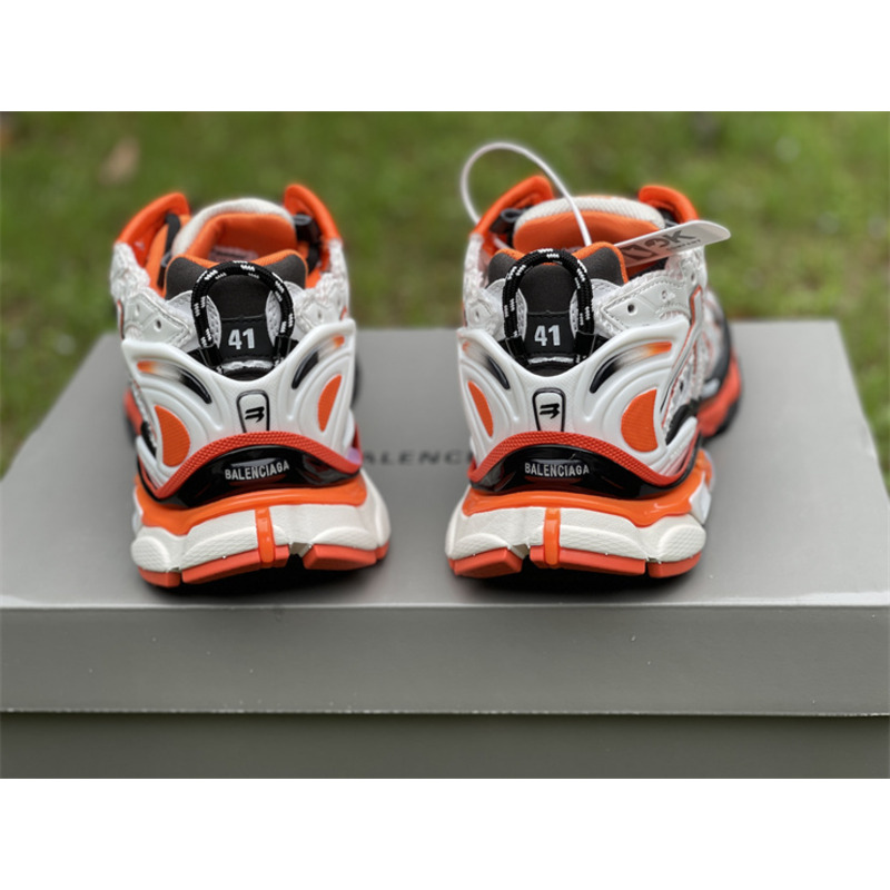 kith x Ba*len*cia*ga runner sneaker white/orange/black