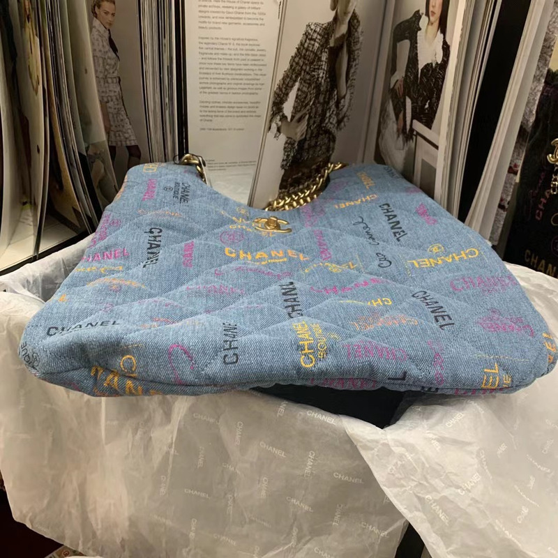 Ch*el  maxi hobo bag printed denim & gold-tone metal blue & multicolor