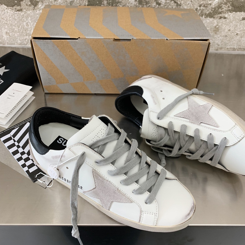 golden goose men’s S*per-star sneakers with suede star and black heel tab