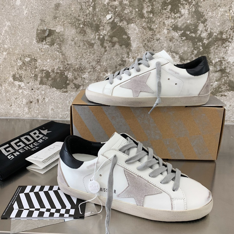 golden goose men’s S*per-star sneakers with suede star and black heel tab