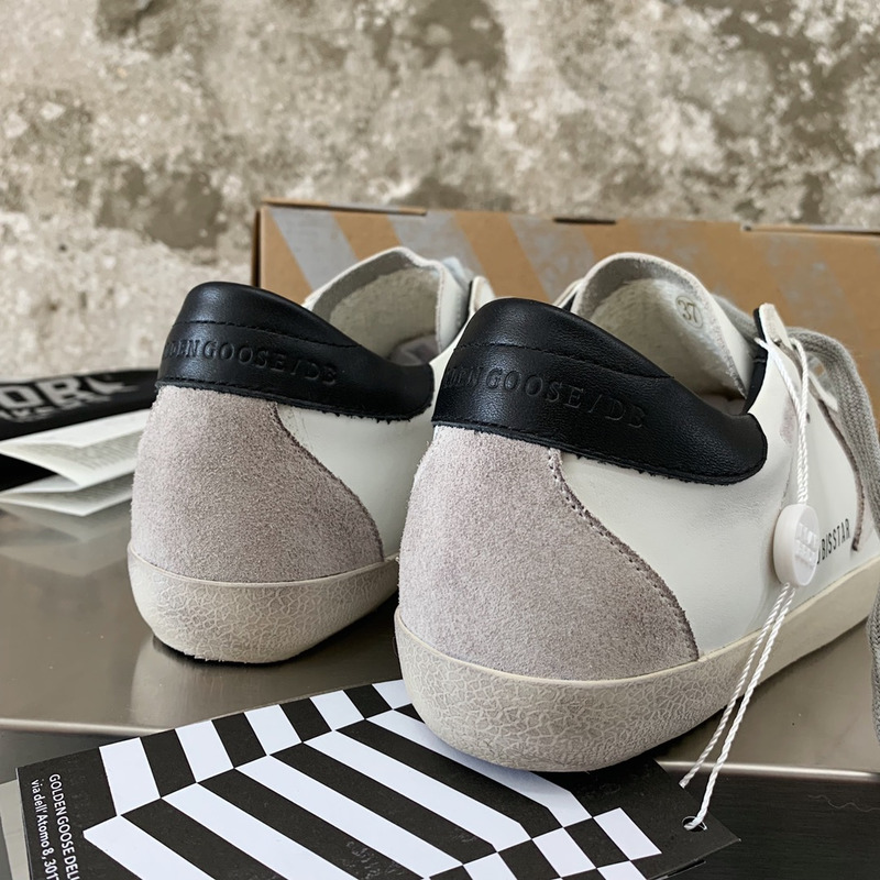 golden goose men’s S*per-star sneakers with suede star and black heel tab