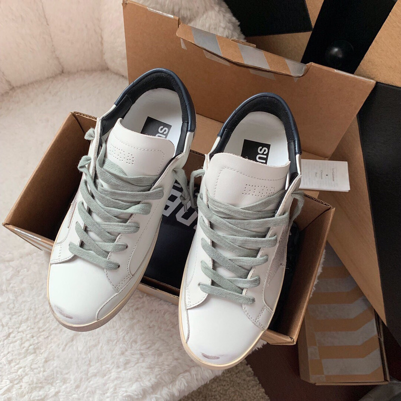 golden goose men’s S*per-star sneakers with suede star and blue heel tab