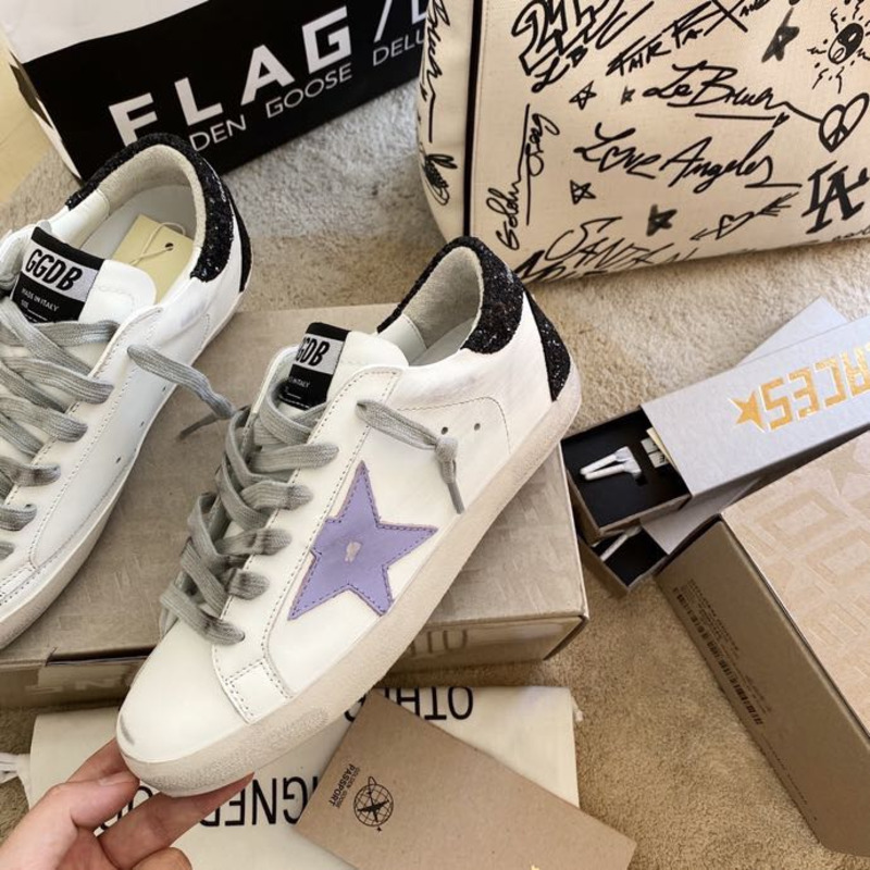 golden goose S*per-star sneakers with purple star logo and black heel tab