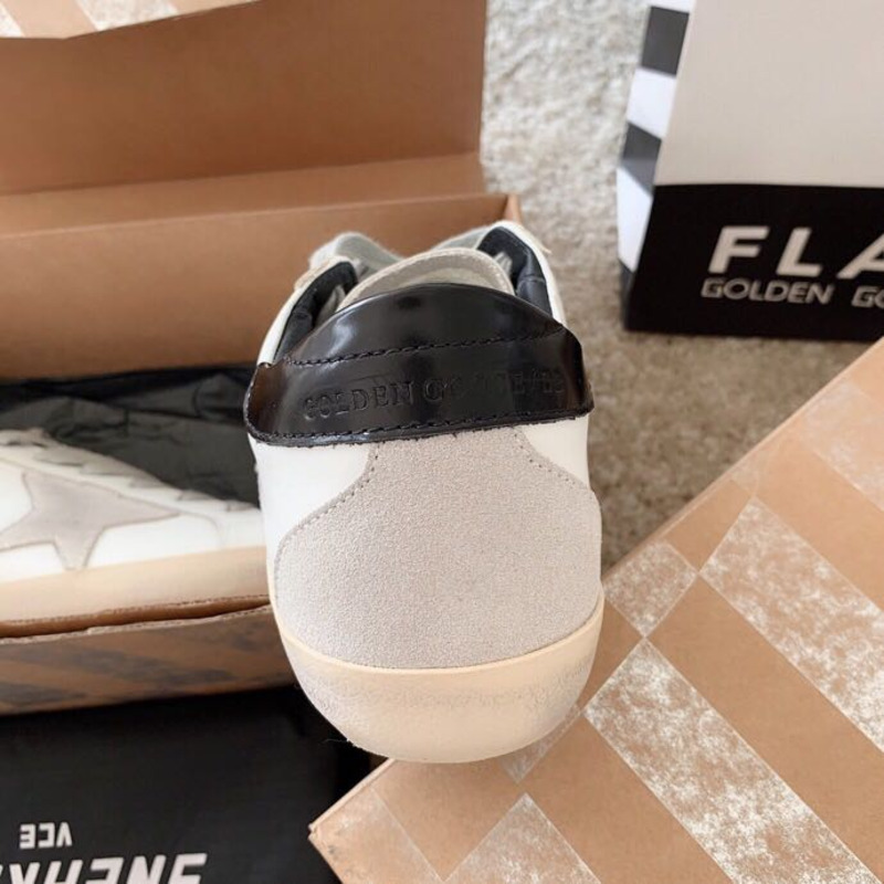 golden goose men’s S*per-star sneakers with suede star and black heel tab