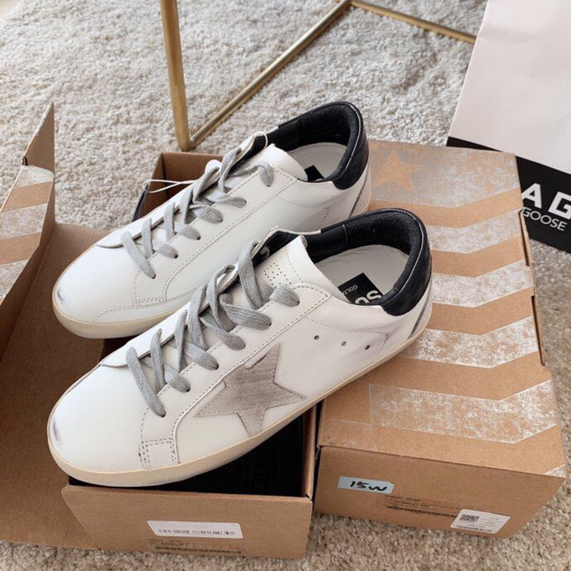 golden goose men’s S*per-star sneakers with suede star and black heel tab