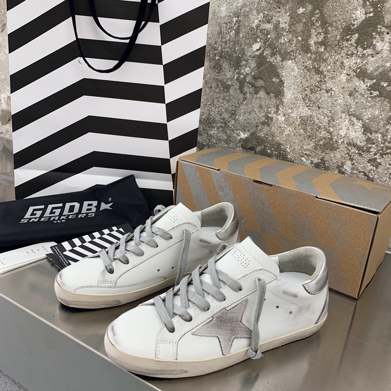 golden goose men’s S*per-star sneakers with suede star and sliver heel tab