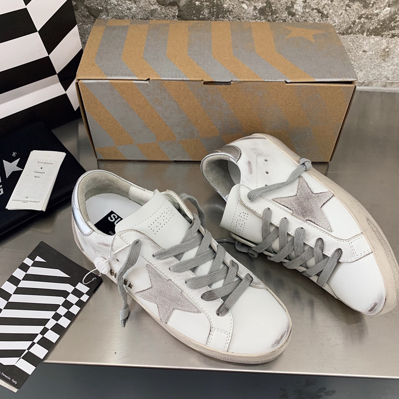 golden goose men’s S*per-star sneakers with suede star and sliver heel tab