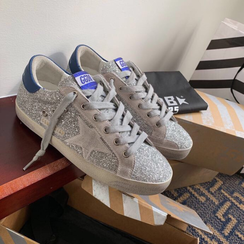 golden goose S*per-star sneakers with sliver glitter and blue heel tab