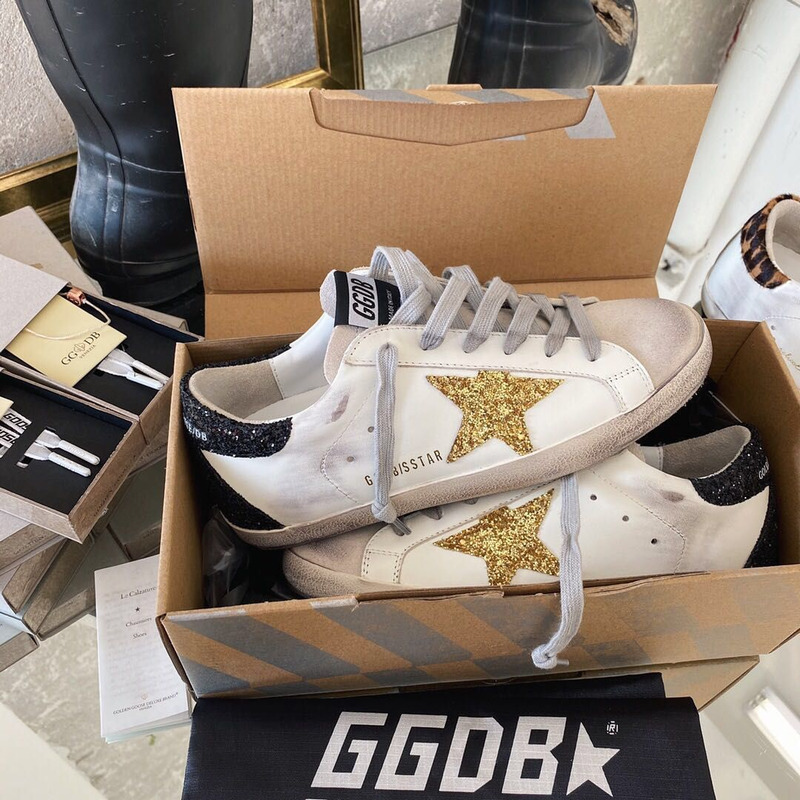 golden goose men’s S*per-star sneakers with golden glitter and black heel tab