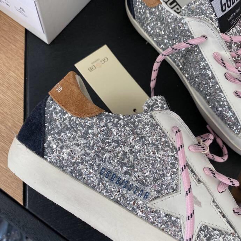 golden goose men’s S*per-star sneakers with sliver glitter and brown heel tab