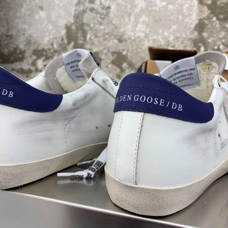 golden goose men’s S*per-star sneakers with sliver glitter star and blue heel tab