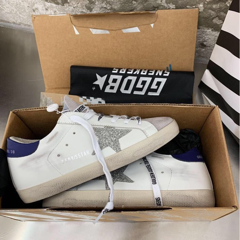 golden goose men’s S*per-star sneakers with sliver glitter star and blue heel tab