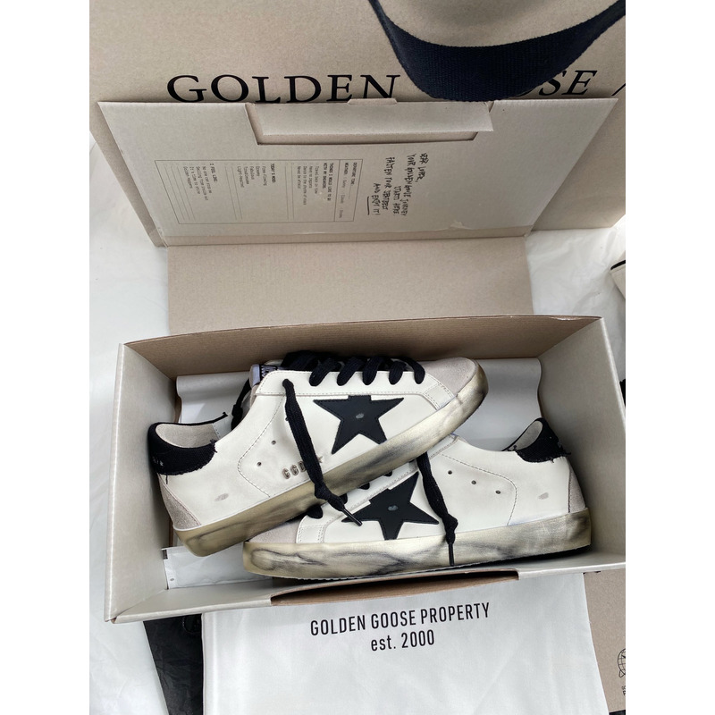 golden goose men’s S*per-star sneakers with black suede star and black heel tab