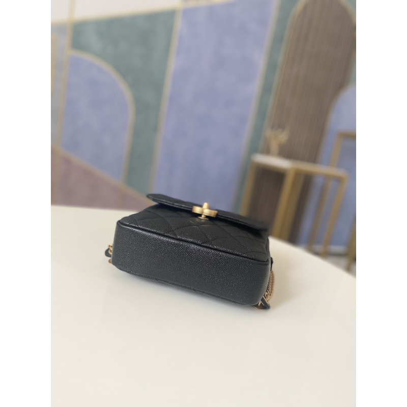 Ch*el grained calfskin & gold-tone metal backpack black