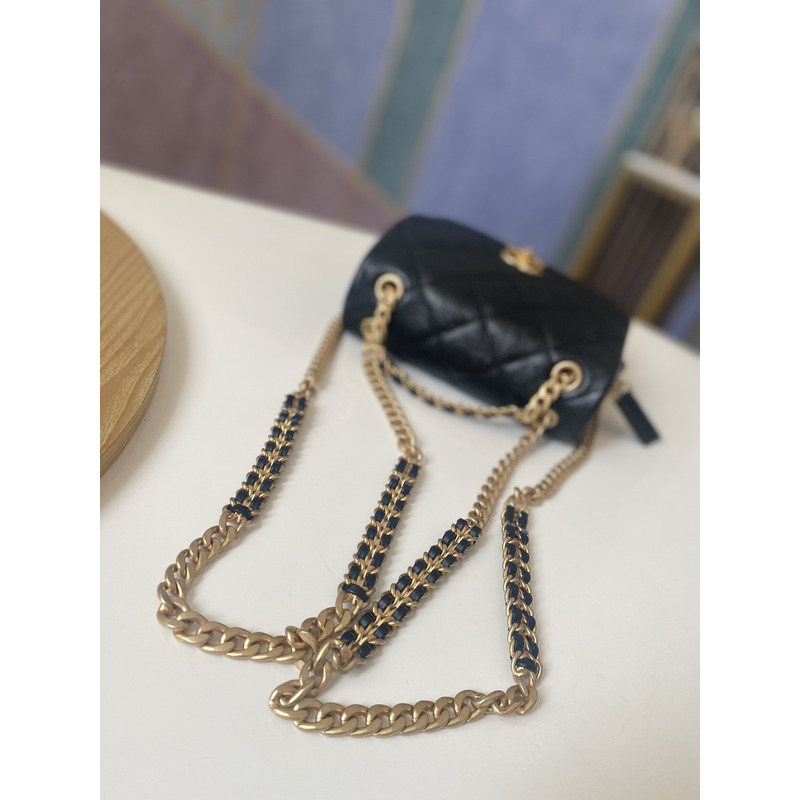 Ch*el grained calfskin & gold-tone metal backpack black