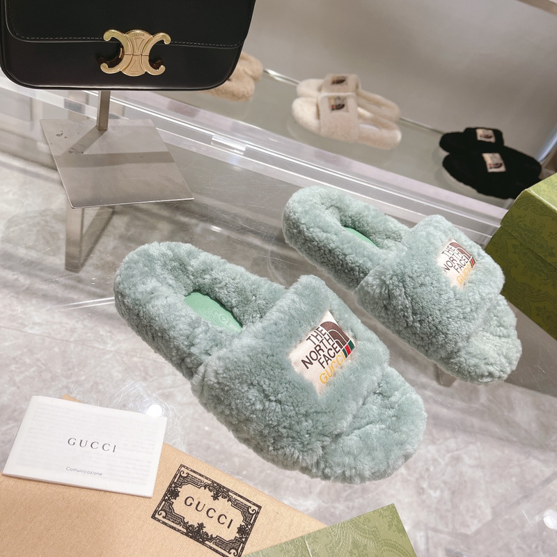g*u*i x the n0*h F**e shearling slides green