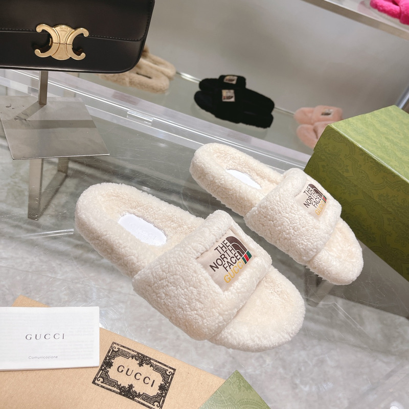 g*u*i x the n0*h F**e shearling slides white