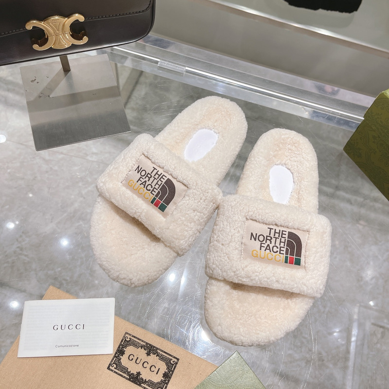 g*u*i x the n0*h F**e shearling slides white