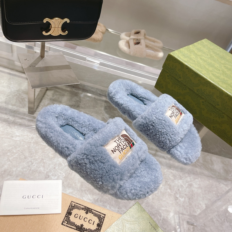 g*u*i x the n0*h F**e shearling slides blue