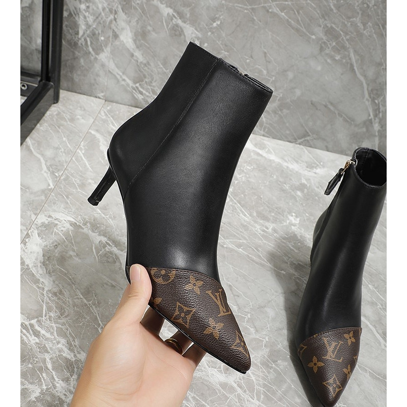 l**is V*t*n logo print ankle boots