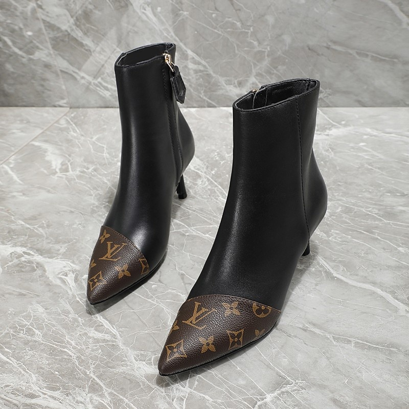 l**is V*t*n logo print ankle boots