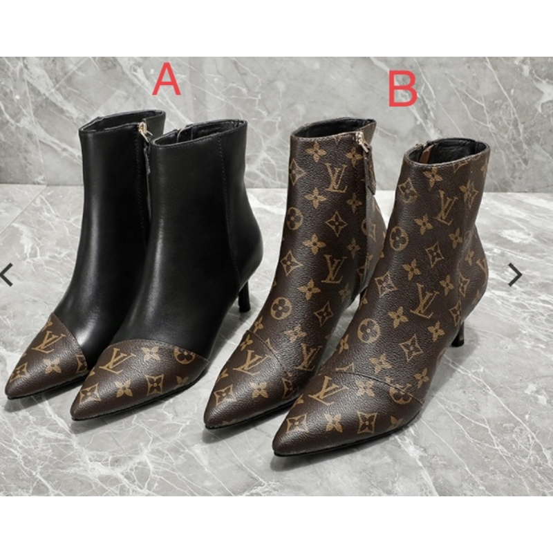 l**is V*t*n logo print ankle boots