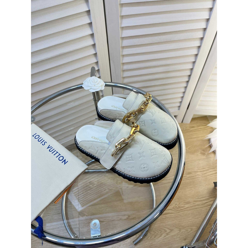 l**is V*t*n fireplace chain in white loafers