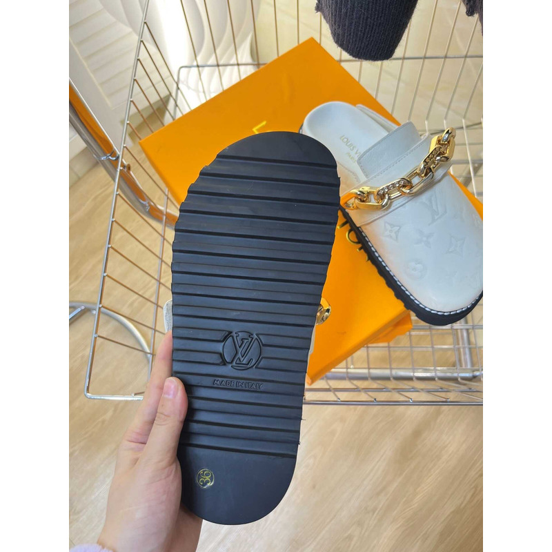 l**is V*t*n fireplace chain in white loafers