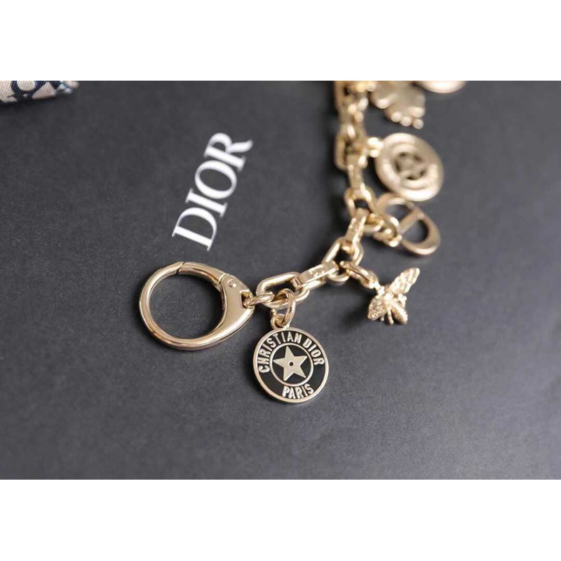 D*or montaingne bag charm gold-finish metal and white resin pearls with black and ethereal pink lacquer