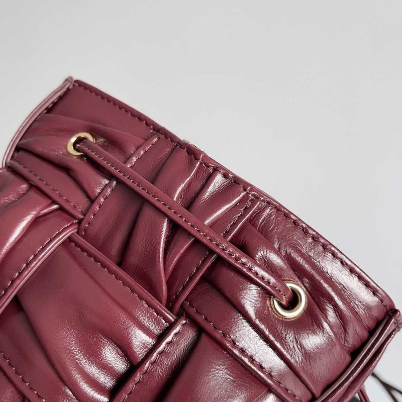 Bo*te*ga ve*ne*ta small sheepskin cassette bucket bag burgundy