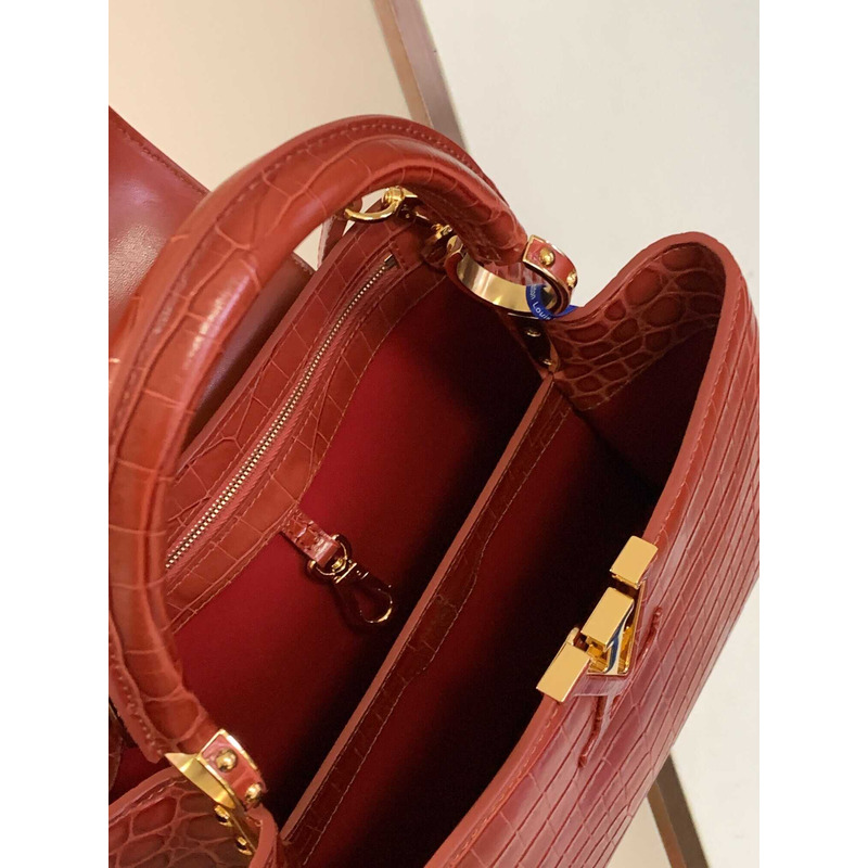 l**is V*t*n capucines mm crocodile skin bags