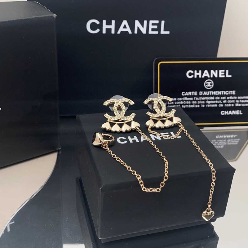 Ch*el metal and crystal earrings