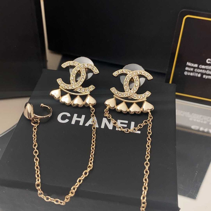 Ch*el metal and crystal earrings