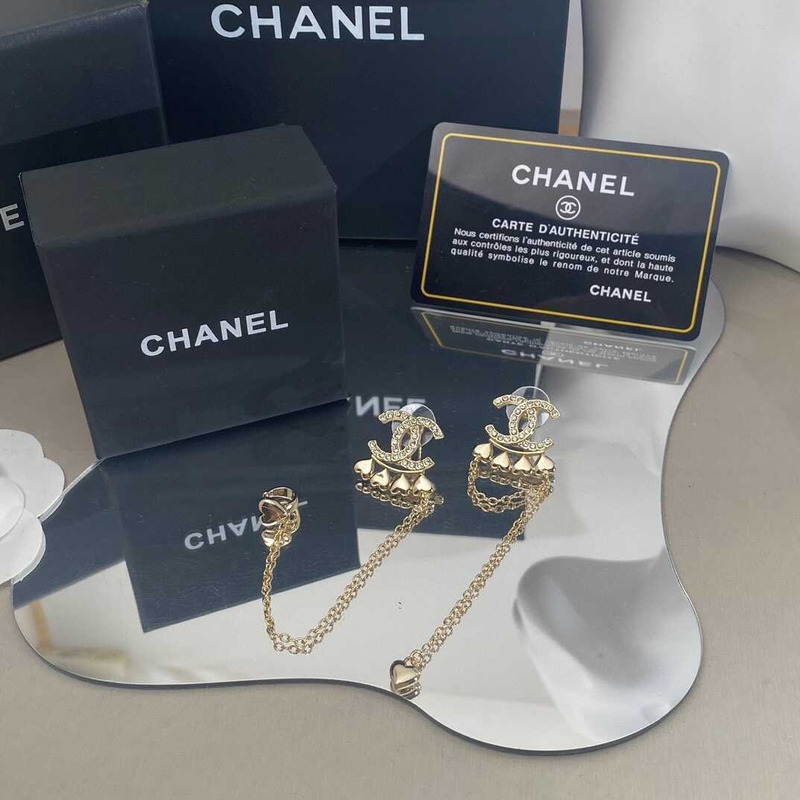 Ch*el metal and crystal earrings