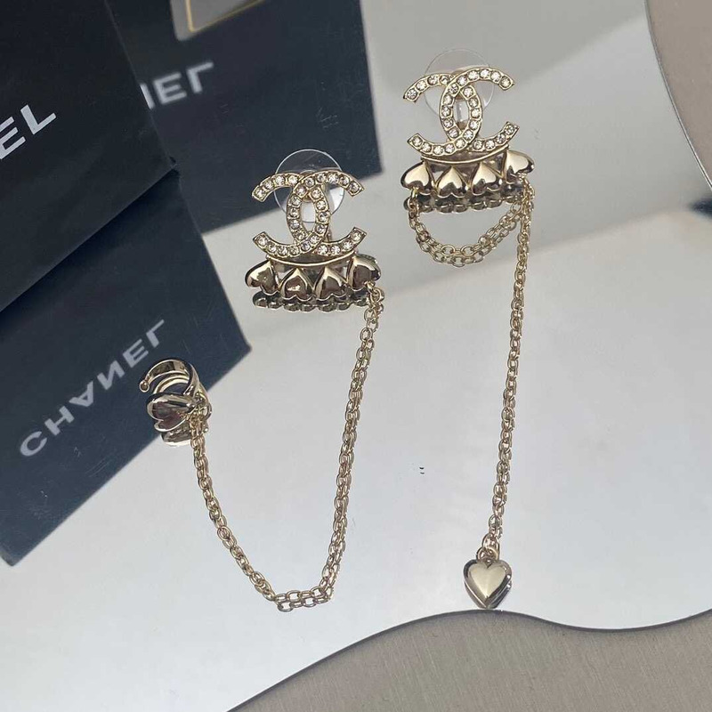 Ch*el metal and crystal earrings