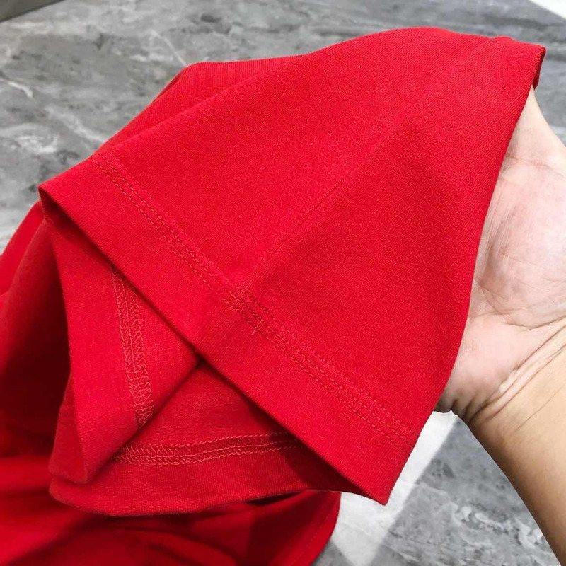 l**is V*t*n t-shirt red calligraphy and a violin case