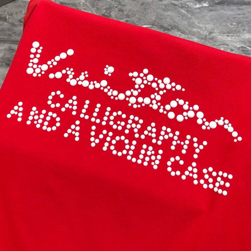 l**is V*t*n t-shirt red calligraphy and a violin case