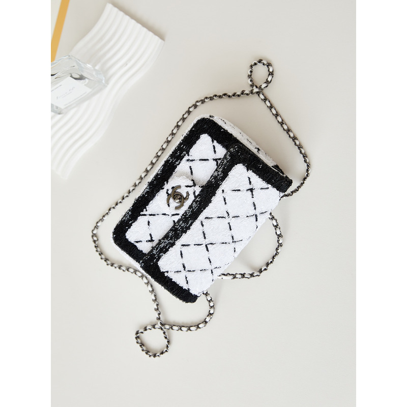 Ch*el large palatine capsule sequins & gold metal white and black