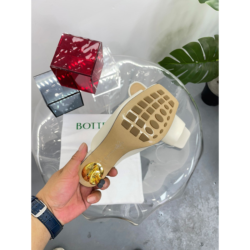 Bo*te*ga ve*ne*ta knot mule with gold finished metal knot heel beige