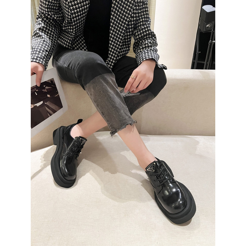 Pra*a triangle-logo brushed leather derby shoes black