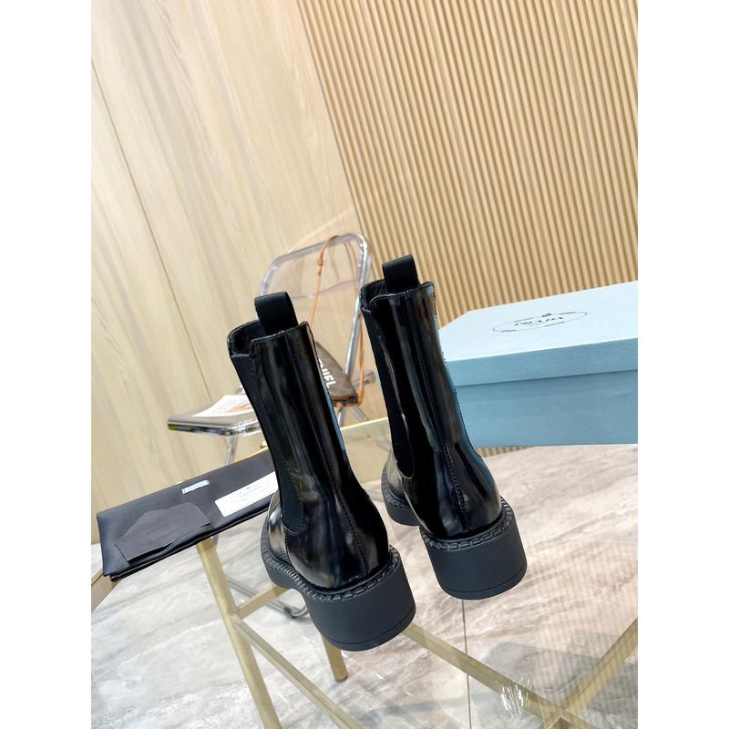 Pra*a metal triangle logo chelsea boots in black