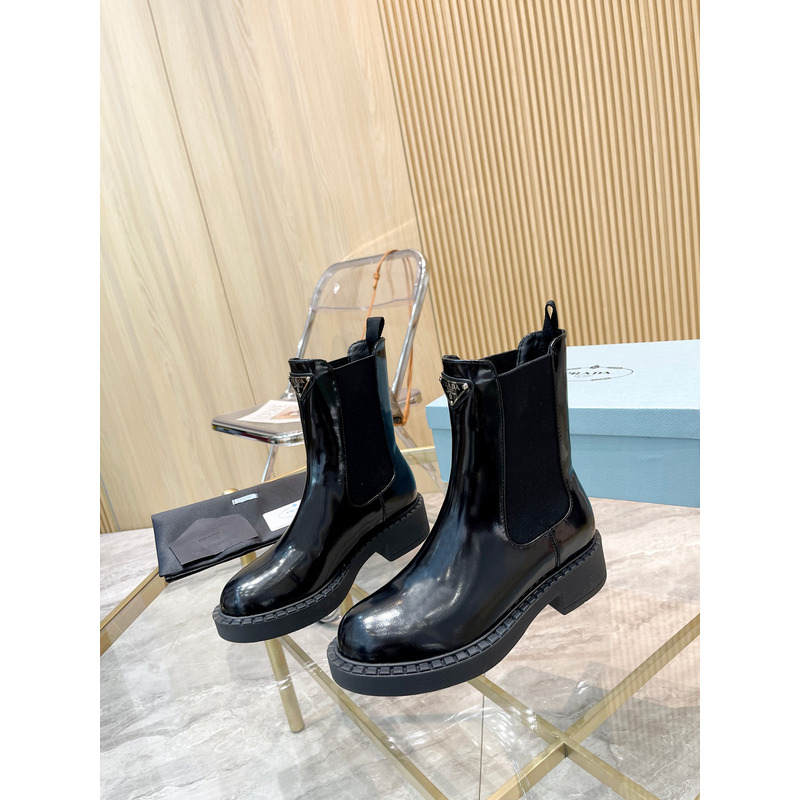 Pra*a metal triangle logo chelsea boots in black