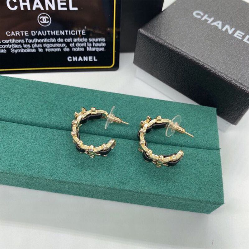 Ch*el  metal and calfskin  crystal earrings