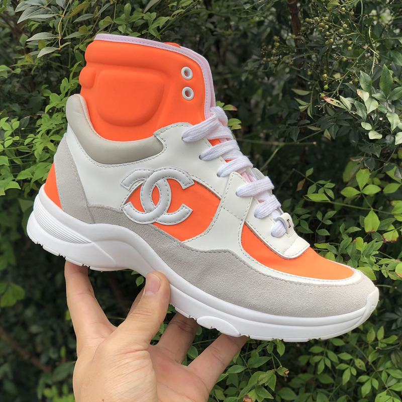 Ch*el calfskin & velvet high top sneaker in orange & white