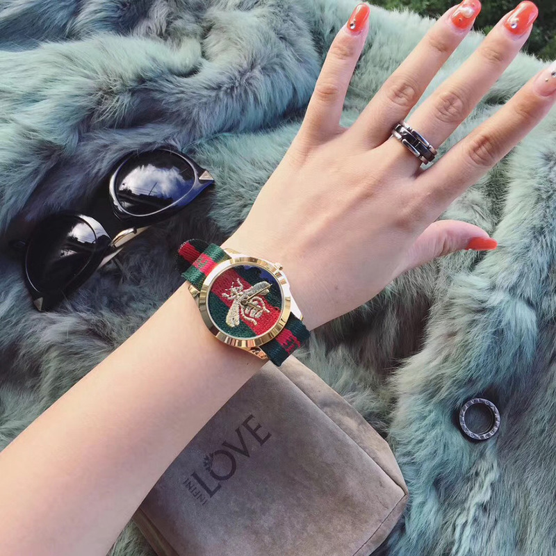 G*u*i red and green web watches with bee embroidery