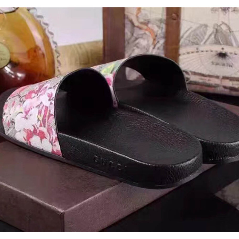 G*u*i bird and flower flip flops